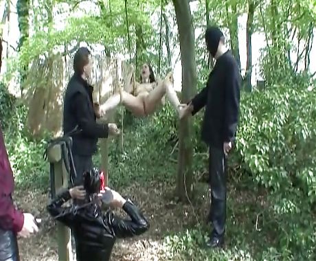 A stunning looking German brunette gets punished in the woods